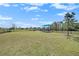 Expansive community lawn with a covered picnic area, all enclosed by a secure fence at 20778 Balsam Hill Rd, Land O Lakes, FL 34638