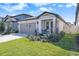 Charming single-story home with a well-manicured lawn and inviting front porch at 20778 Balsam Hill Rd, Land O Lakes, FL 34638