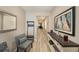 Inviting home hallway featuring light wood floors and stylish decor at 20778 Balsam Hill Rd, Land O Lakes, FL 34638