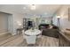 Bright living room with hardwood floors, open layout, and lots of natural light at 20778 Balsam Hill Rd, Land O Lakes, FL 34638