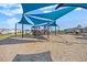 Community playground featuring a large, covered play structure with slides and climbing areas at 20778 Balsam Hill Rd, Land O Lakes, FL 34638