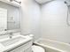 Bright bathroom featuring tiled shower, new fixtures, and a modern vanity at 2253 Norwegian Dr # 67, Clearwater, FL 33763
