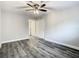 Bedroom featuring wood-look floors and a ceiling fan at 2253 Norwegian Dr # 67, Clearwater, FL 33763