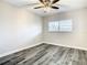 Bedroom with window, ceiling fan, plank-style floors and neutral paint at 2253 Norwegian Dr # 67, Clearwater, FL 33763