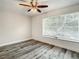 Bedroom features include a ceiling fan, window with blinds, and plank-style floors at 2253 Norwegian Dr # 67, Clearwater, FL 33763