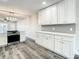 Bright, renovated kitchen with white cabinets, stainless steel oven, and an open floorplan at 2253 Norwegian Dr # 67, Clearwater, FL 33763
