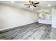 Open-concept living space that flows into a kitchen, complete with stylish wood floors at 2253 Norwegian Dr # 67, Clearwater, FL 33763