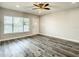 Bright living room with sleek ceiling fan, window, and modern flooring that enhances space at 2253 Norwegian Dr # 67, Clearwater, FL 33763