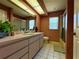 Bathroom with a long vanity, neutral tile floor, and shower and tub combination at 22941 Leafwood Ct, Land O Lakes, FL 34639