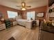 Bright bedroom features wood-look floors, and large windows for ample natural light at 22941 Leafwood Ct, Land O Lakes, FL 34639