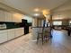 Well-appointed kitchen with breakfast bar overlooking the spacious living area, perfect for entertaining guests at 22941 Leafwood Ct, Land O Lakes, FL 34639