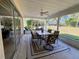 Outdoor patio with a large dining table and view of the backyard at 22941 Leafwood Ct, Land O Lakes, FL 34639