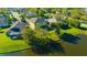 Aerial shot of home showing backyard leading to a lake surrounded by other houses at 2734 Silvermoss Dr, Wesley Chapel, FL 33544