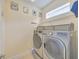 Laundry room featuring stainless steel washer and dryer at 2734 Silvermoss Dr, Wesley Chapel, FL 33544