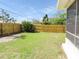 Lush green backyard featuring a new wooden privacy fence at 3094 Vernon Ter, Largo, FL 33770