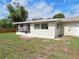 View of the home's backyard and screened in back porch area at 3094 Vernon Ter, Largo, FL 33770