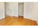 A bedroom featuring hardwood floors and an ample closet space at 3094 Vernon Ter, Largo, FL 33770