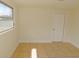Bright bedroom features neutral walls, tile flooring, and a window for natural light at 3094 Vernon Ter, Largo, FL 33770