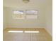 Bedroom featuring tile flooring and two windows bringing in natural light at 3094 Vernon Ter, Largo, FL 33770