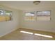 Bedroom with tile flooring and lots of natural light from three windows at 3094 Vernon Ter, Largo, FL 33770