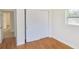 Bright bedroom with hardwood floors, a closet, and natural light from the window at 3094 Vernon Ter, Largo, FL 33770