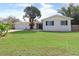 Charming single-story home featuring a well-manicured front yard and attached garage at 3094 Vernon Ter, Largo, FL 33770