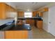 An open kitchen with tile floors, stainless steel appliances, and granite countertops at 3094 Vernon Ter, Largo, FL 33770