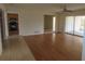 Open-concept living room featuring hardwood floors and a ceiling fan at 3094 Vernon Ter, Largo, FL 33770