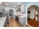 Kitchen showcasing stainless steel appliances, light gray cabinets, and hardwood floors at 315 Princess St, Clearwater, FL 33755