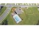 Aerial view showcasing community pool, playground, and dog park providing recreational opportunities for residents at 35542 Buttonweed, Zephyrhills, FL 33541