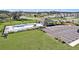 Aerial view of a community pool, playground and parking lot in a well manicured common area at 35542 Buttonweed, Zephyrhills, FL 33541