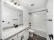 Bathroom featuring modern vanity, granite countertops, and shower-tub combo at 35542 Buttonweed, Zephyrhills, FL 33541
