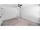 Spacious bedroom featuring plush carpet, neutral walls, and ample natural light at 35542 Buttonweed, Zephyrhills, FL 33541
