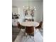 Bright dining area features a modern chandelier, seating for four, and stylish decor at 35542 Buttonweed, Zephyrhills, FL 33541