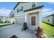 Charming exterior highlighting a well-manicured lawn, an attached garage, and a welcoming front door at 35542 Buttonweed, Zephyrhills, FL 33541