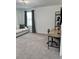 Bright living room features stylish furniture, modern lighting, and large window at 35542 Buttonweed, Zephyrhills, FL 33541