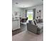 Open-concept living area with view to the kitchen, dining area, and sliding glass doors to patio at 35542 Buttonweed, Zephyrhills, FL 33541