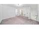 Bright loft featuring plush carpeting and multiple entry doors for flexible living spaces at 35542 Buttonweed, Zephyrhills, FL 33541