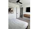 Serene main bedroom with a plush bed, mounted TV, and modern decor at 35542 Buttonweed, Zephyrhills, FL 33541