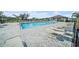 Relaxing pool area featuring lounge chairs, tables, and a covered pavilion for comfortable outdoor enjoyment at 35542 Buttonweed, Zephyrhills, FL 33541