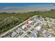 Aerial view of homes in a coastal community near green space and waterways at 3639 Richboro Dr, Holiday, FL 34691