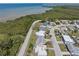 Aerial view of a neighborhood near water with lush greenery at 3639 Richboro Dr, Holiday, FL 34691