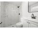 Beautiful bathroom with marble tile shower, modern fixtures, and a sleek vanity at 3639 Richboro Dr, Holiday, FL 34691