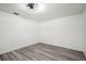 Bright bedroom features modern ceiling fan and stylish wood-look flooring at 3639 Richboro Dr, Holiday, FL 34691