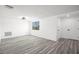 Bright bedroom with new gray vinyl floors and a window providing ample natural light at 3639 Richboro Dr, Holiday, FL 34691