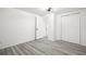 Clean bedroom features a closet and light wood-look flooring at 3639 Richboro Dr, Holiday, FL 34691