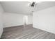 Bright living room with new gray vinyl floors with an open floor plan at 3639 Richboro Dr, Holiday, FL 34691