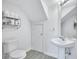 Clean bathroom with a pedestal sink, tile floors, white walls and a white toilet at 4106 Waterside Island Ct, Tampa, FL 33617