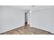 Spacious bedroom featuring wood floors and closet at 4106 Waterside Island Ct, Tampa, FL 33617