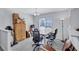 Bright dining area with large window, tile floor and a chandelier over a wood table at 4106 Waterside Island Ct, Tampa, FL 33617